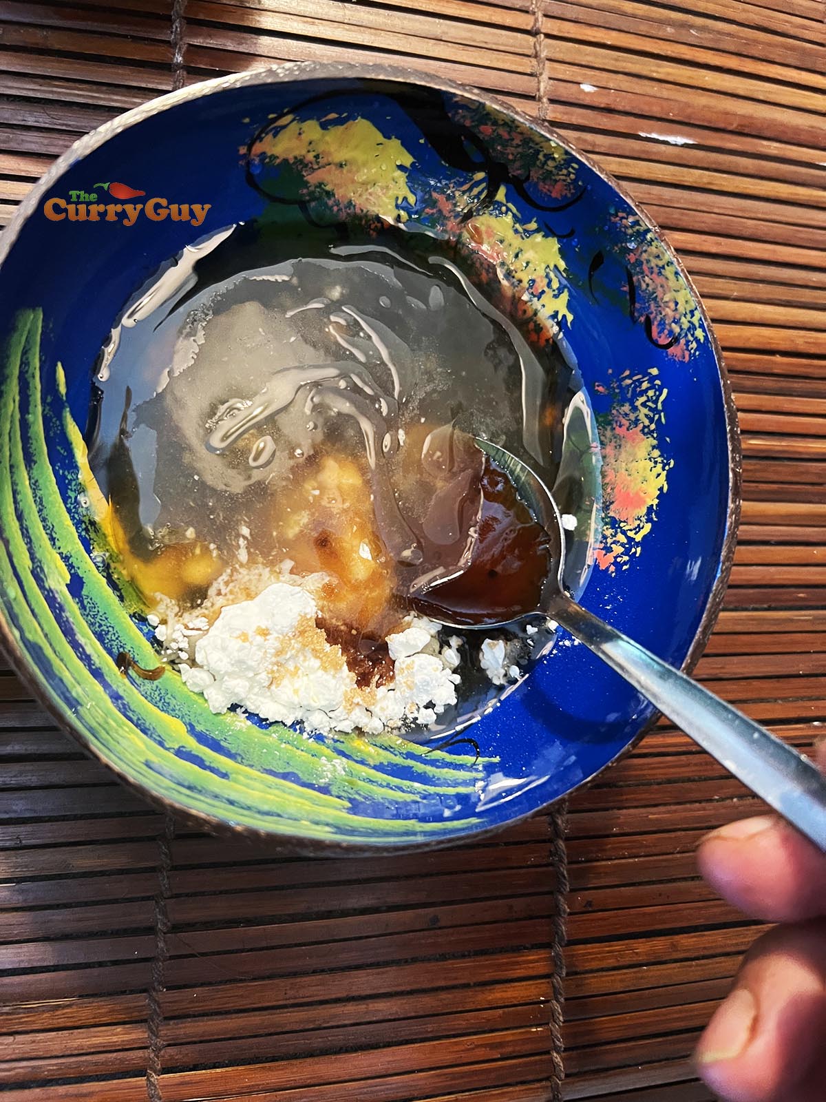 Mixing the sauce ingredients together.