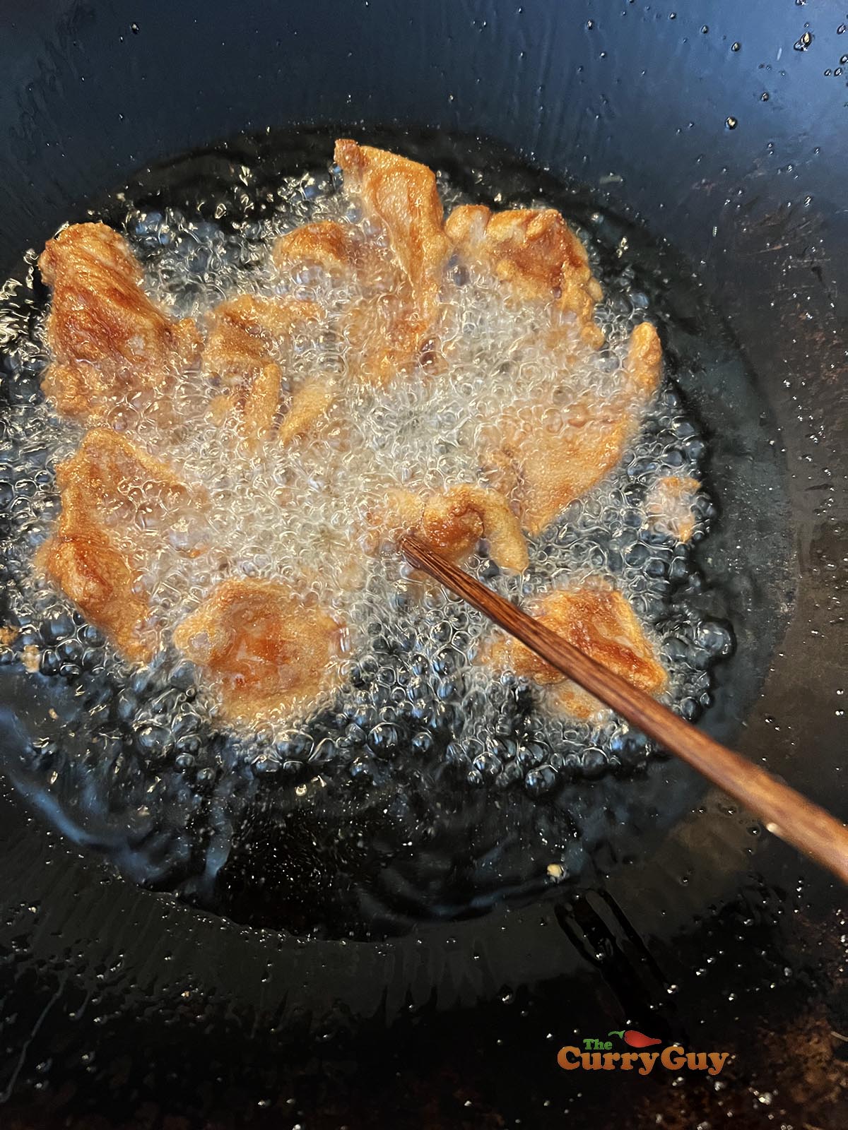 Frying the chicken.