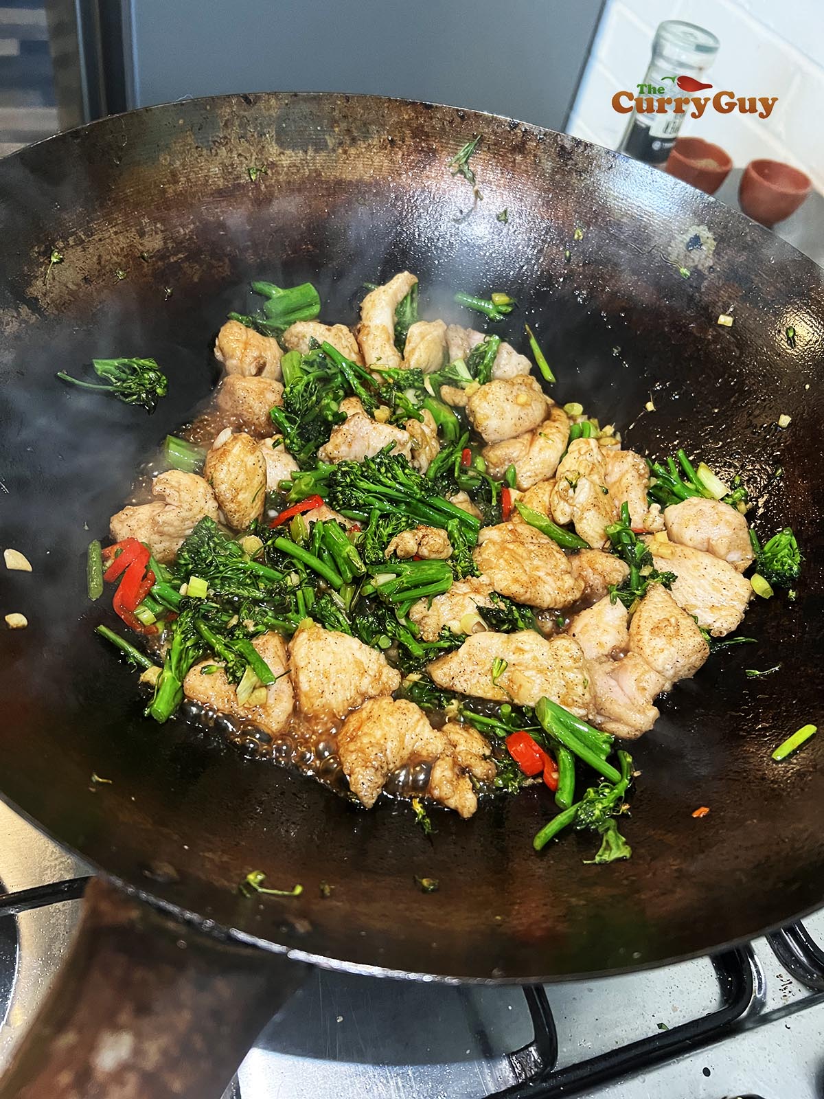 Finishing the crispy chicken and broccoli stir fry