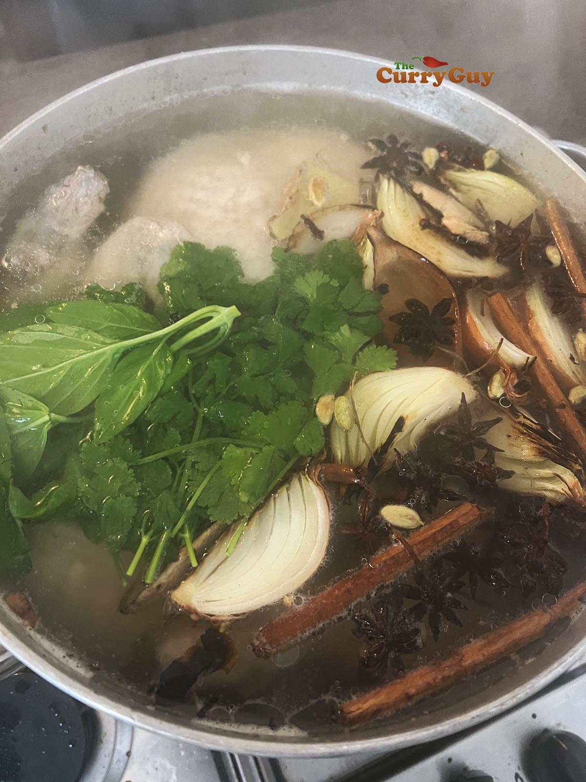 Simmering chicken pho