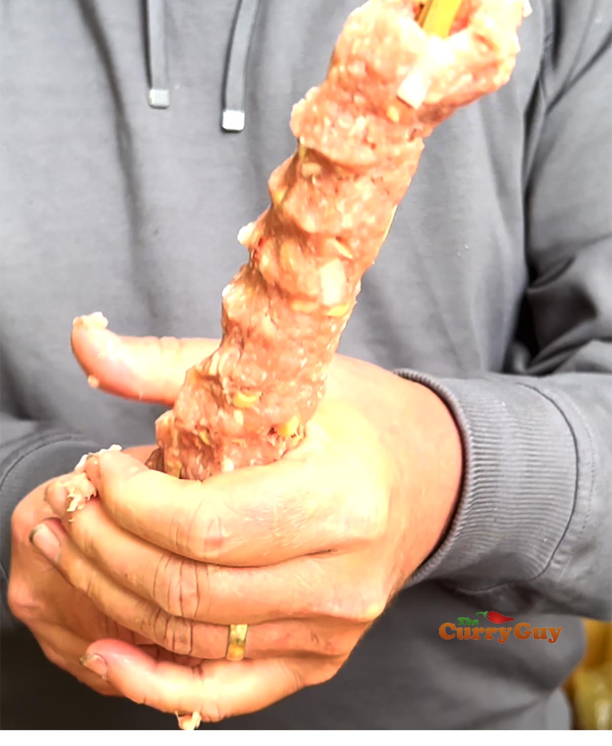 Forming pork and lemongrass skewers