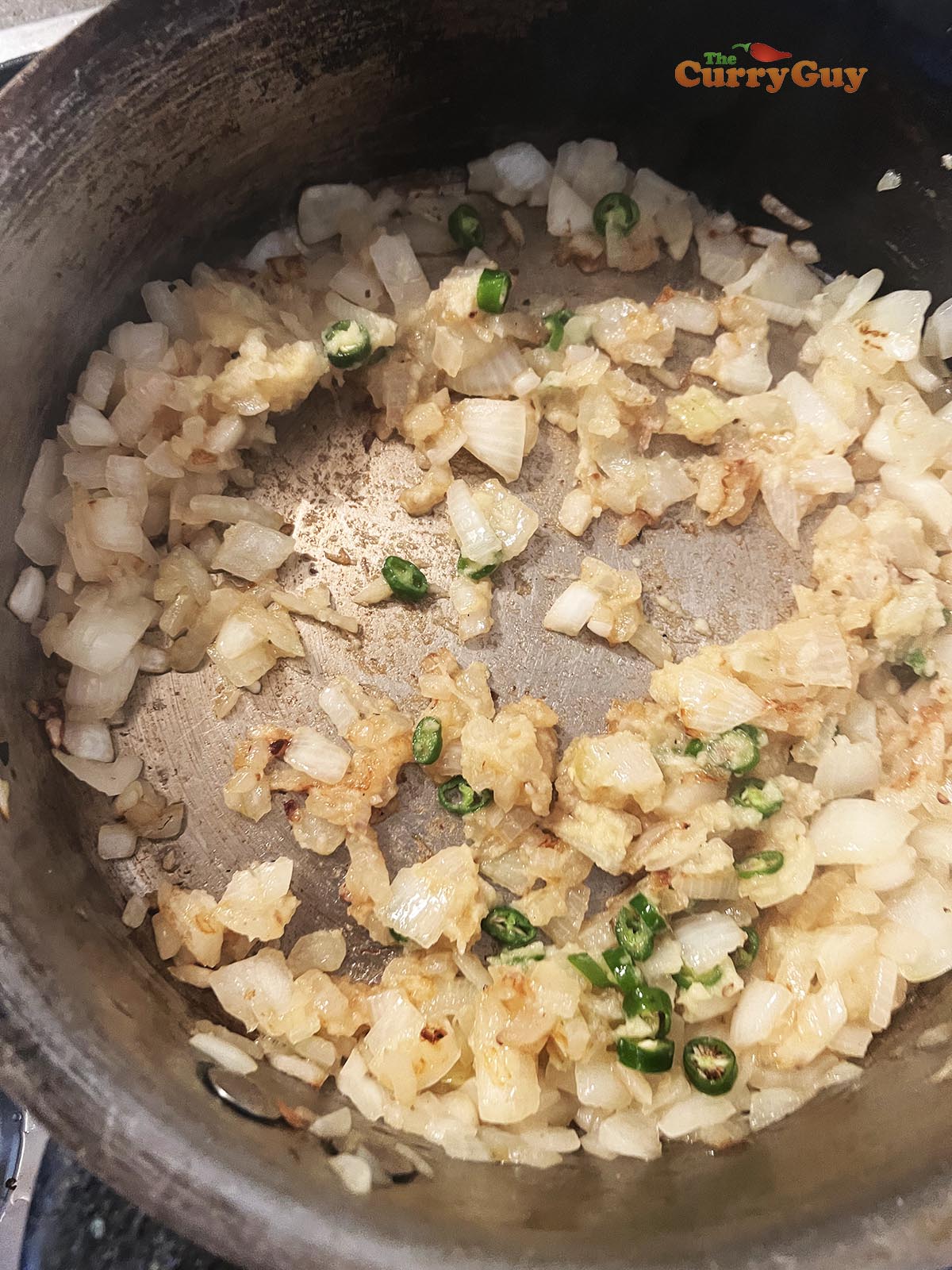 Frying garlic and ginger paste and chillies.