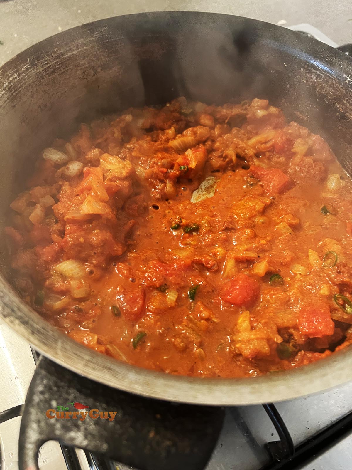 Adding stock to the sauce