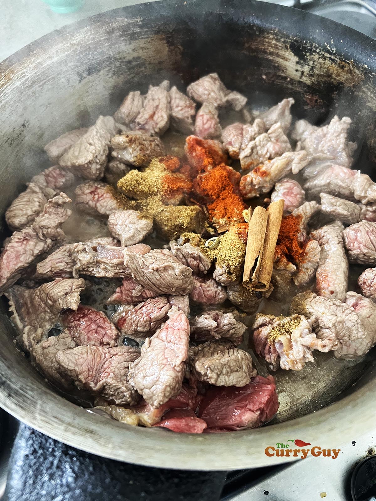 Cooking the beef for the Madras curry