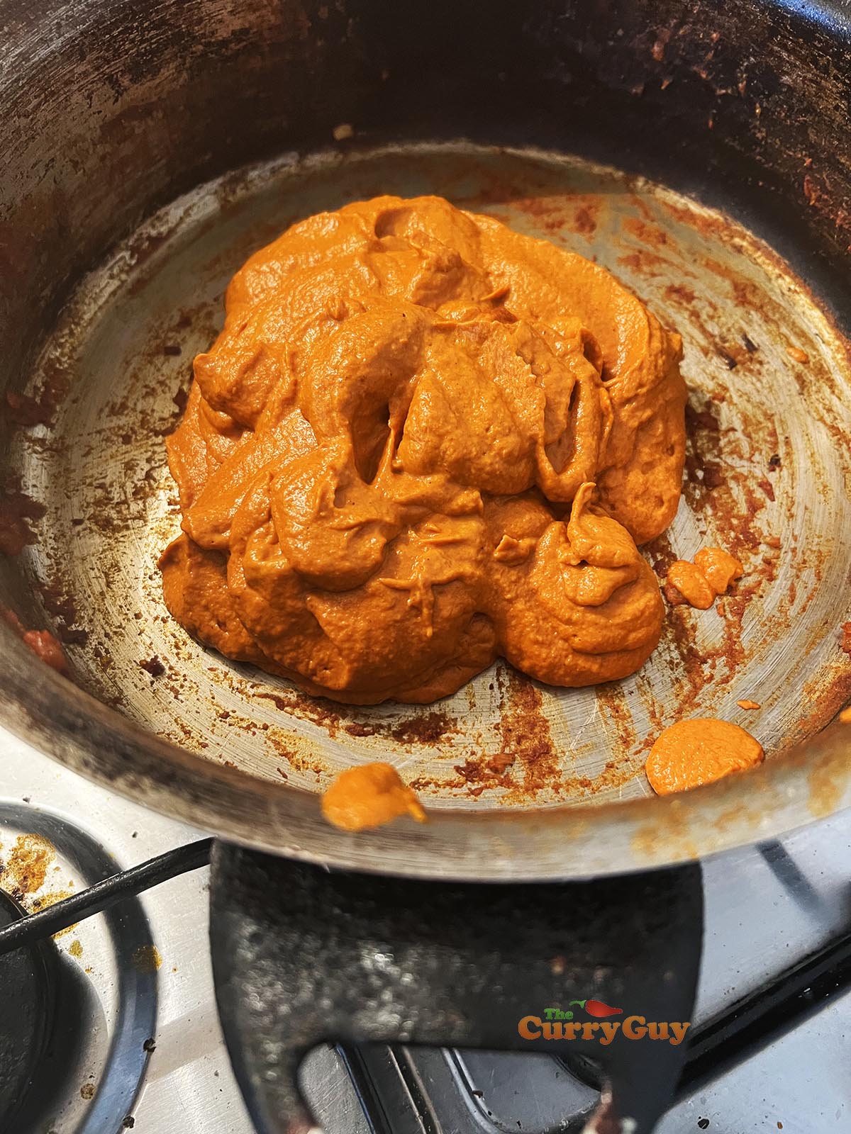 Adding blended sauce to pan.