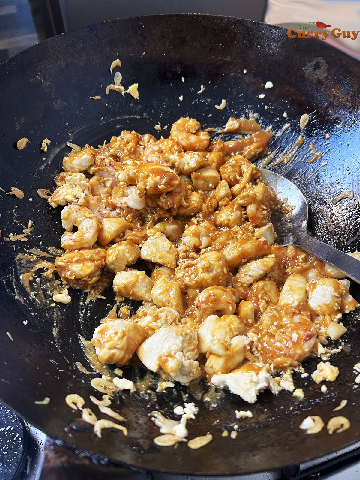 Stirring in the peanut butter sauce