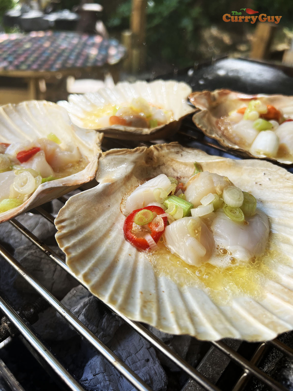 Scallops topped with oil.