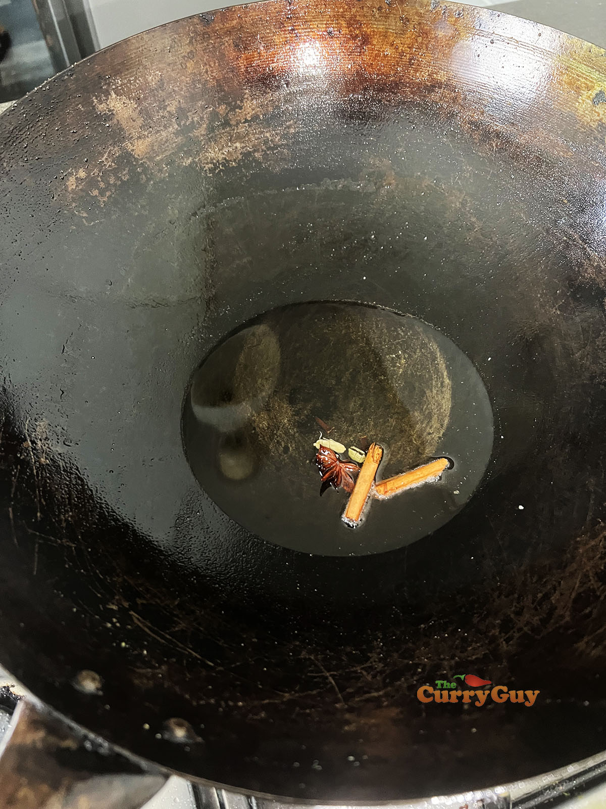 Infusing whole spices in the oil.