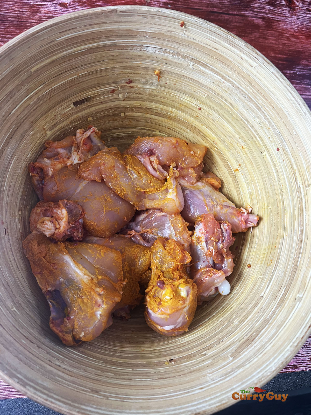 Chicken marinating in lemon juice, salt and ground turmeric