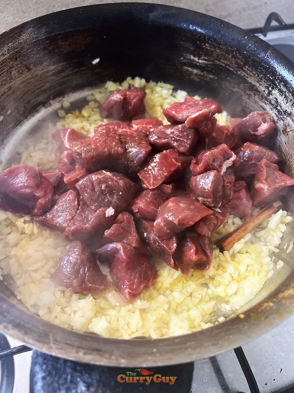 Adding meat to the pan