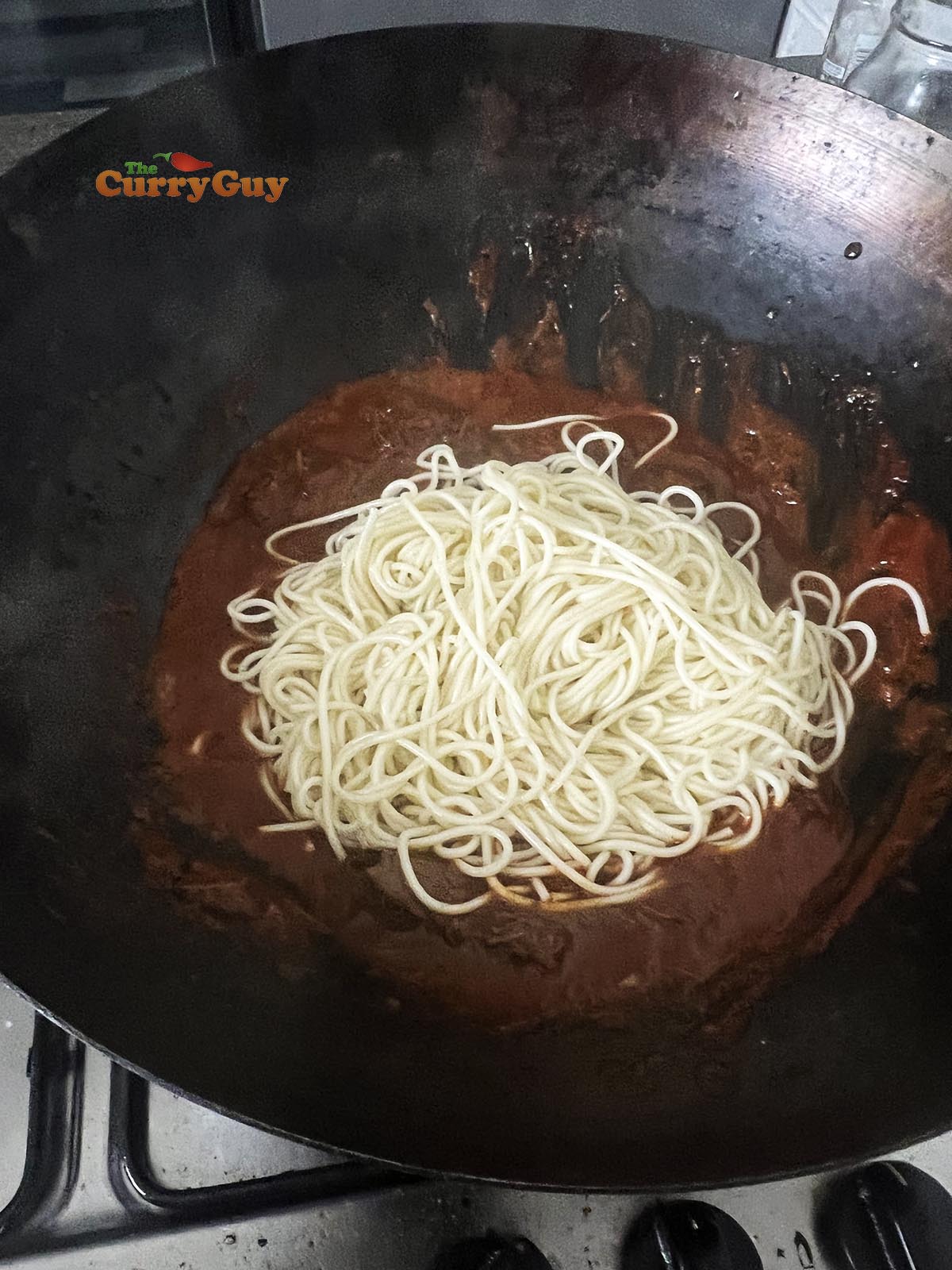 Noodles in birria de res sauce
