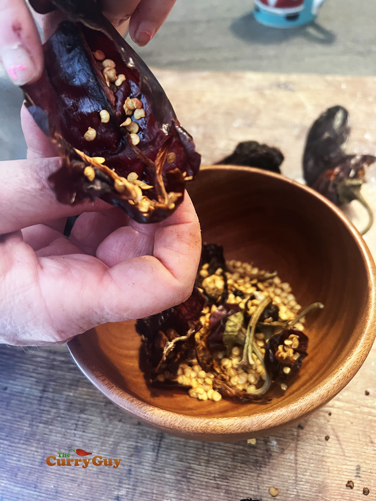 Removing seeds from dried chillies