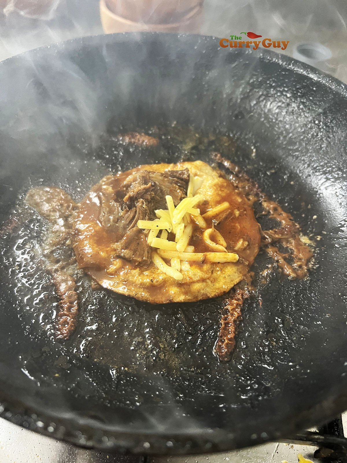 Birria taco with meat and cheese