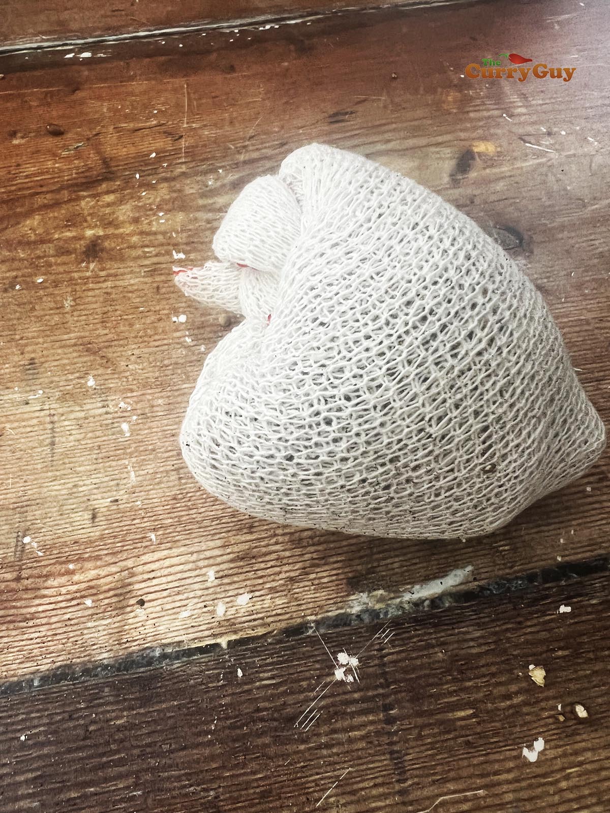 Tied cloth with spices in it.