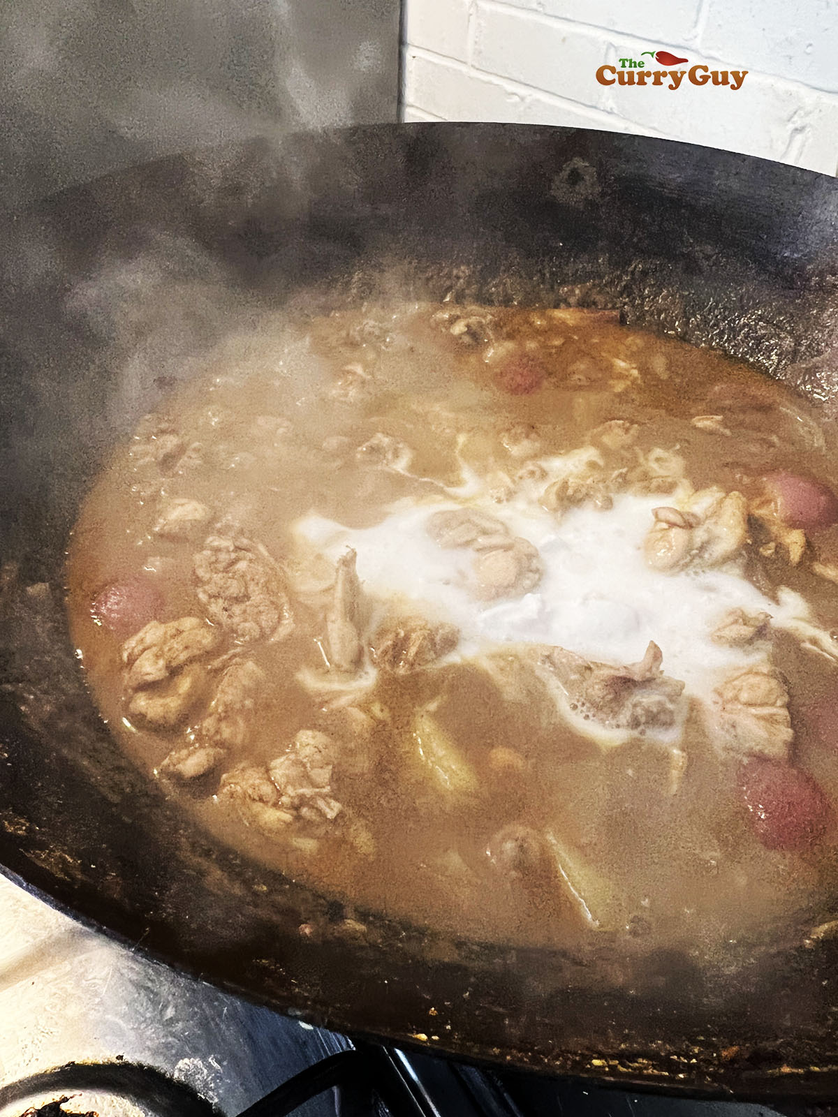 Finishing the massaman curry cook