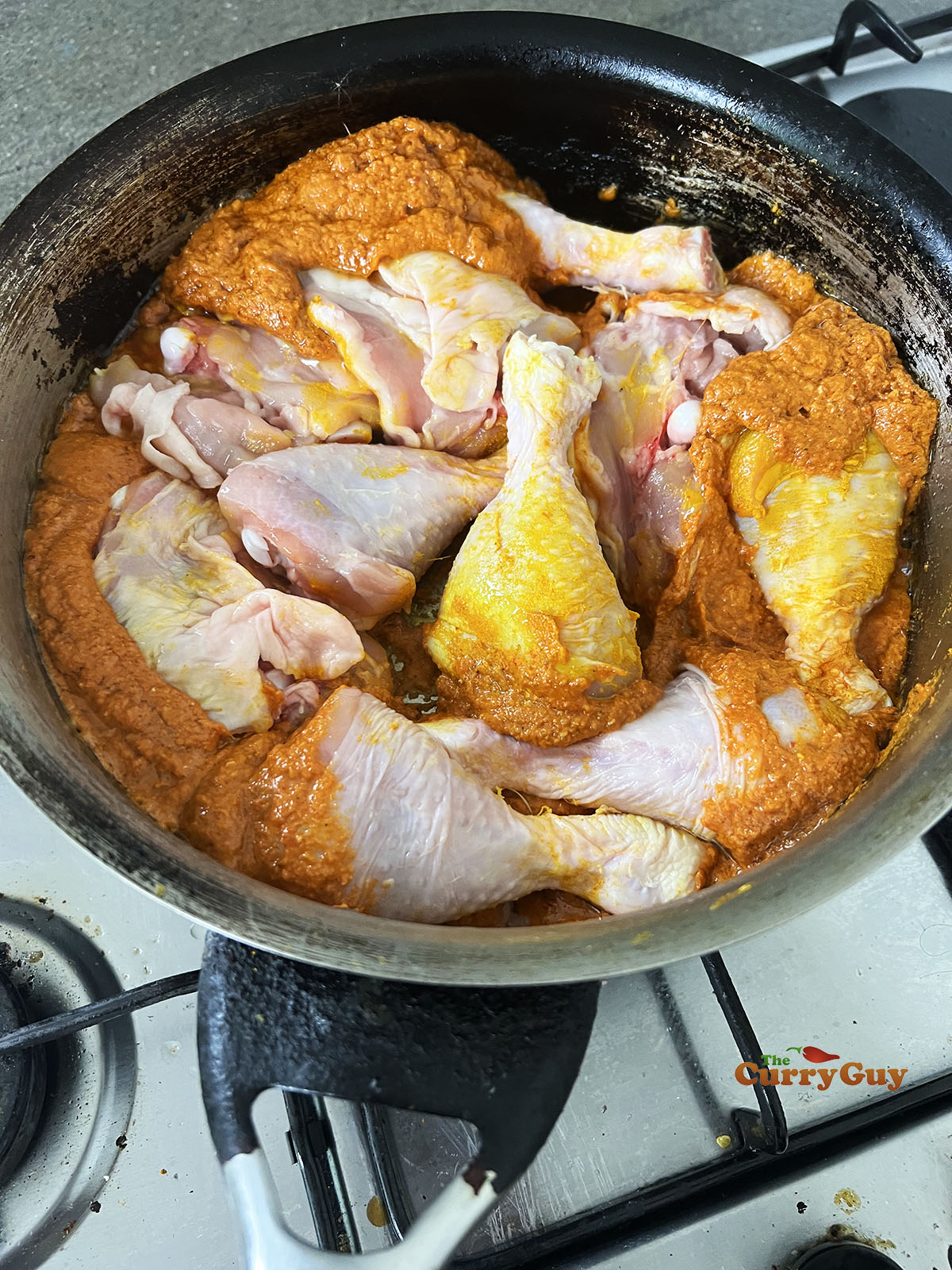 Adding chicken to the pan