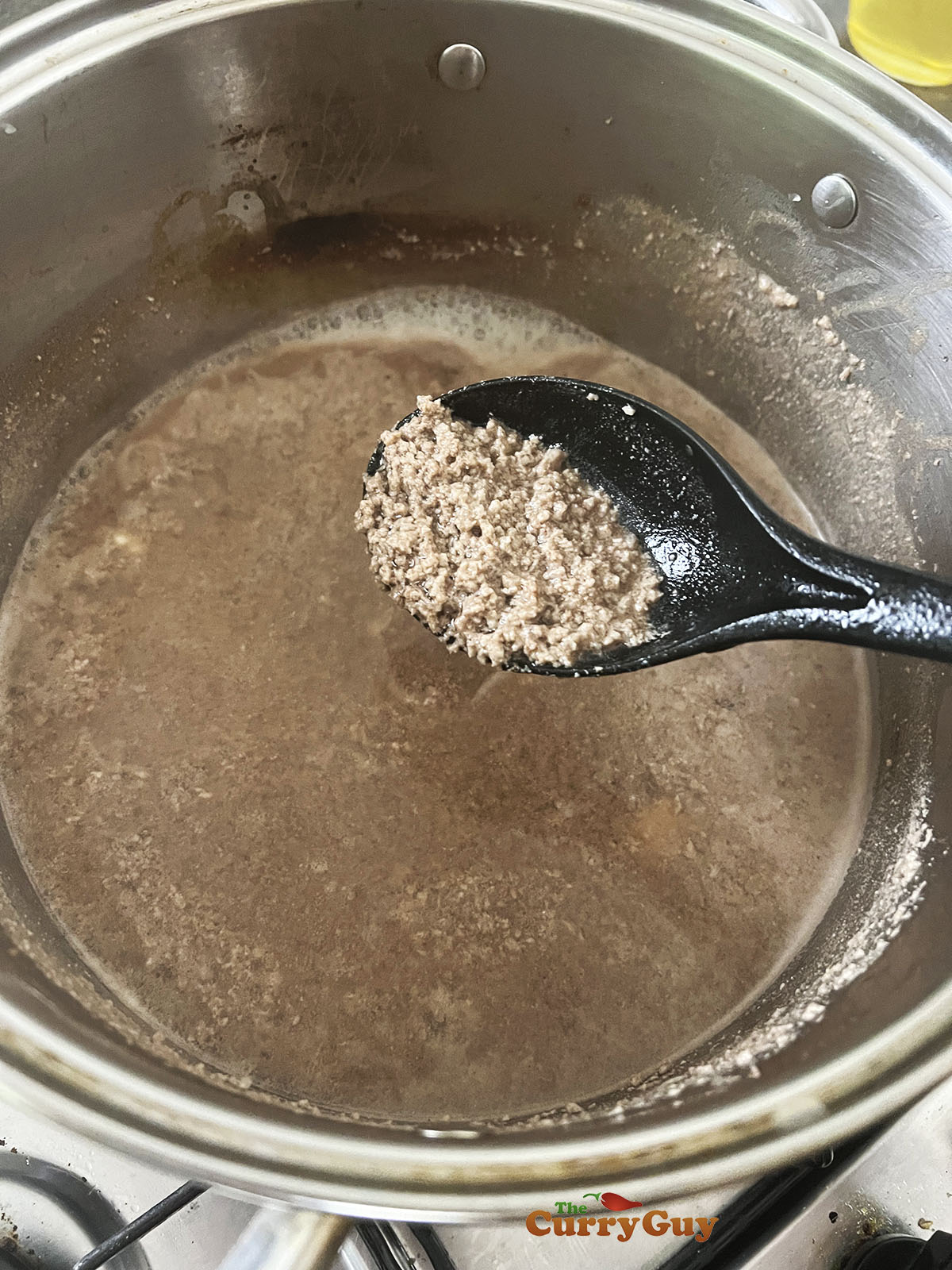 Rice and beef cooking in congee