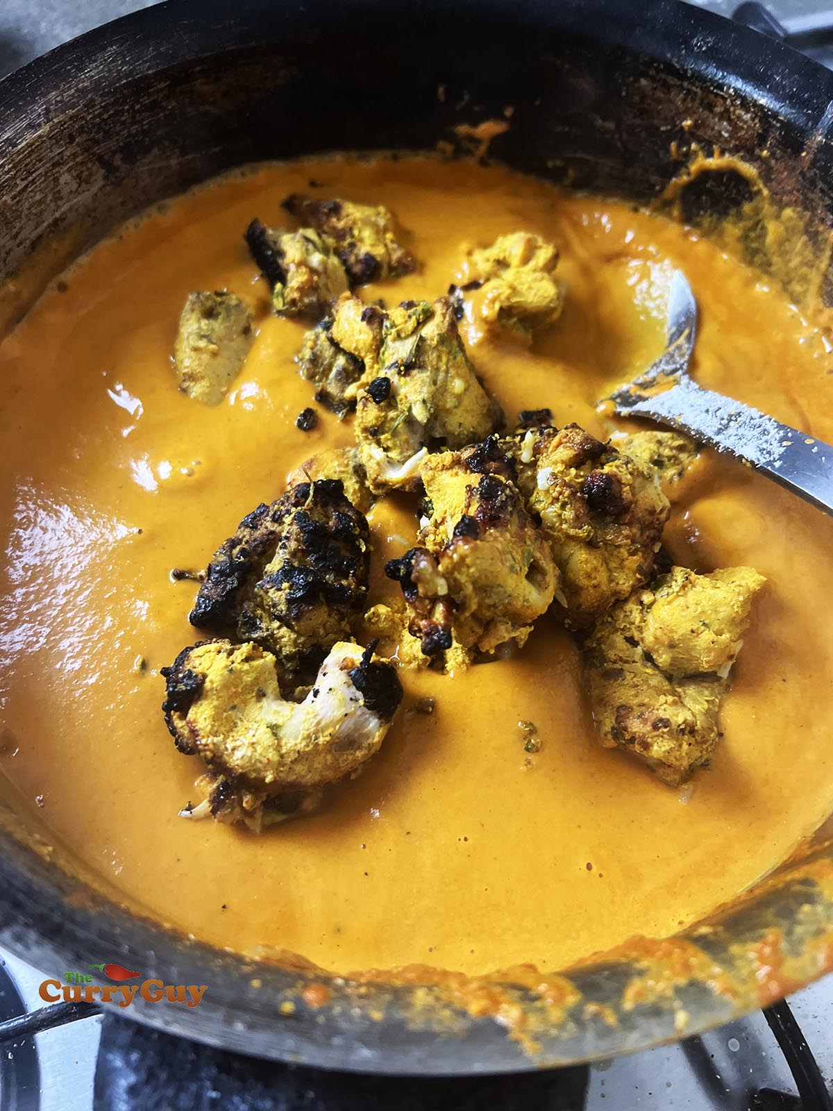 Adding chicken to the pan