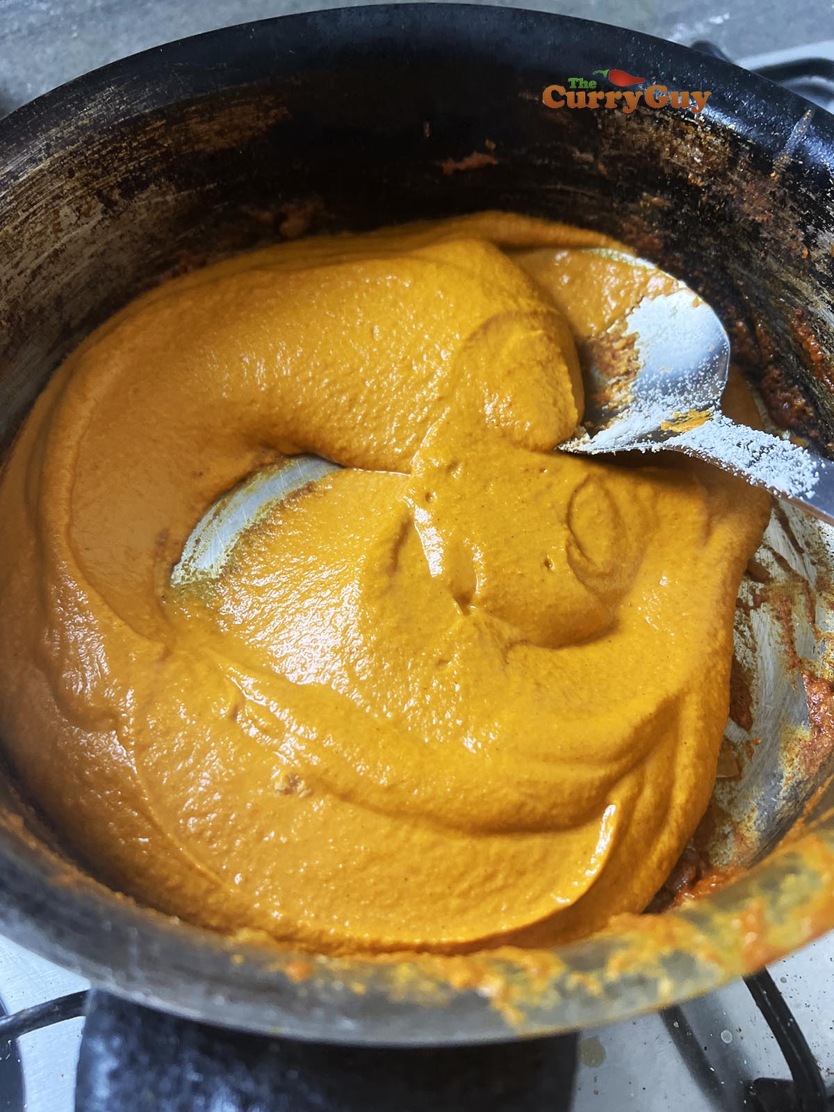 Adding blended sauce to pan