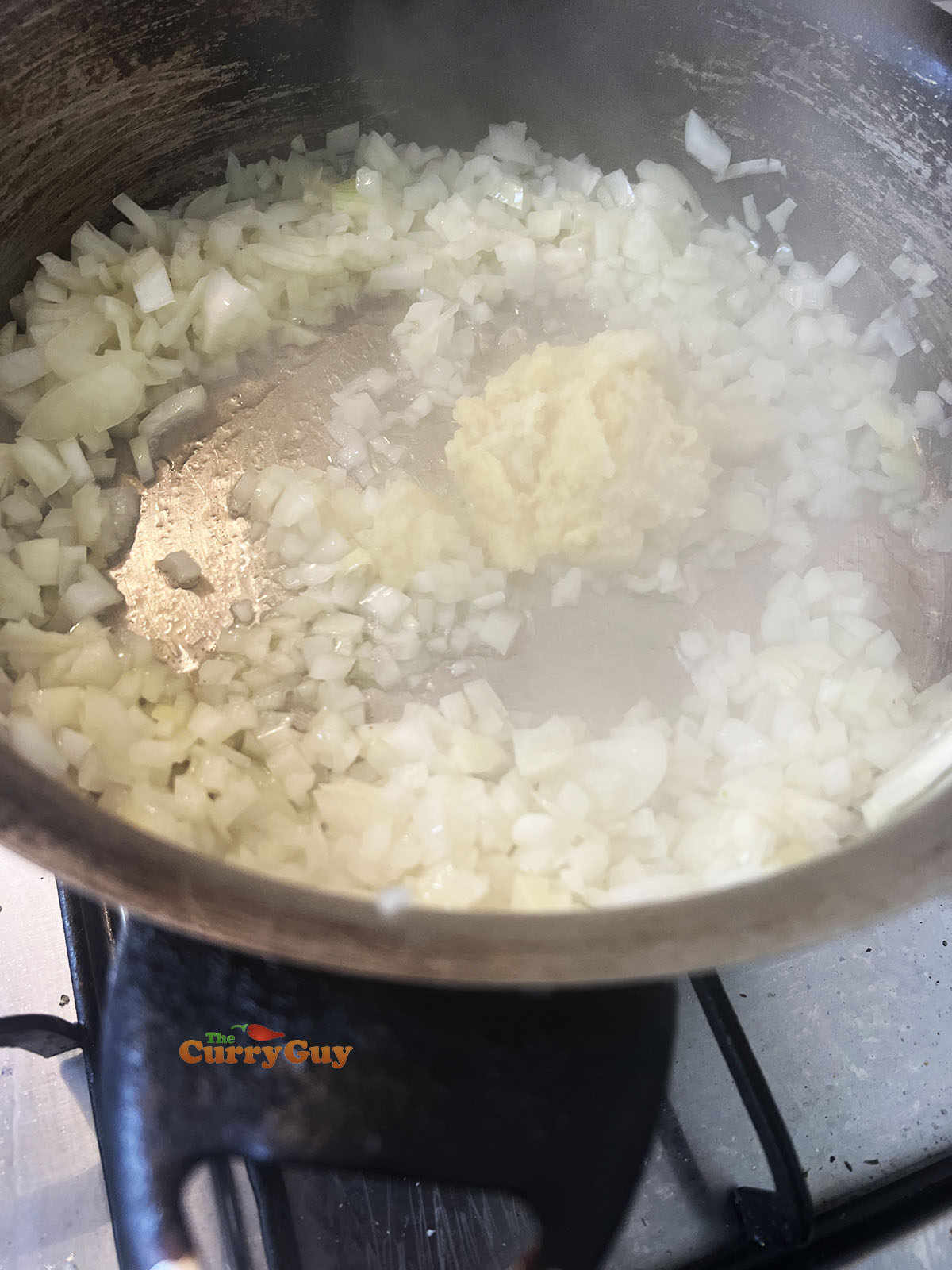 Frying onions, garlic and ginger in the pan