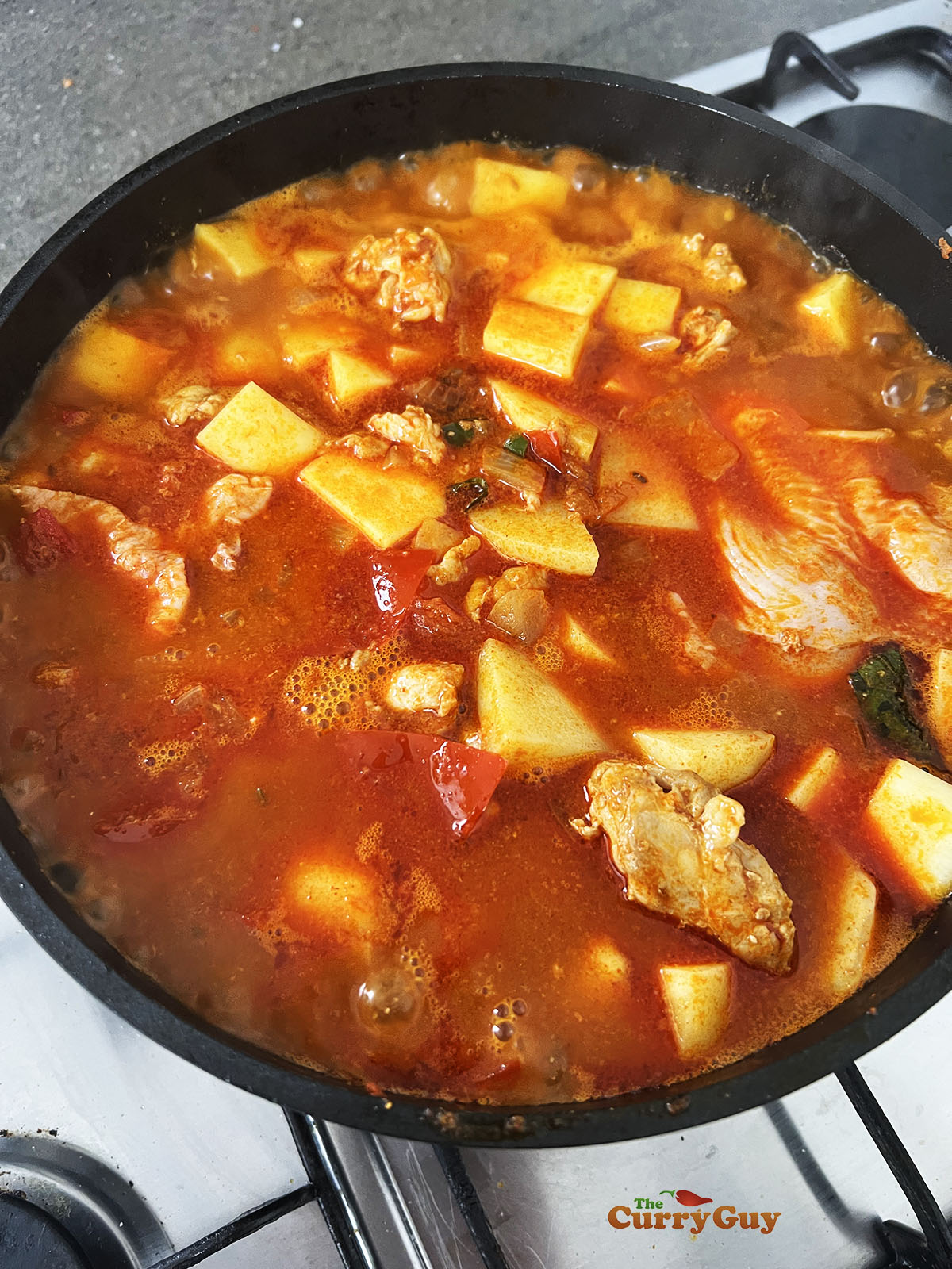 Adding swede and potatoes to the pan