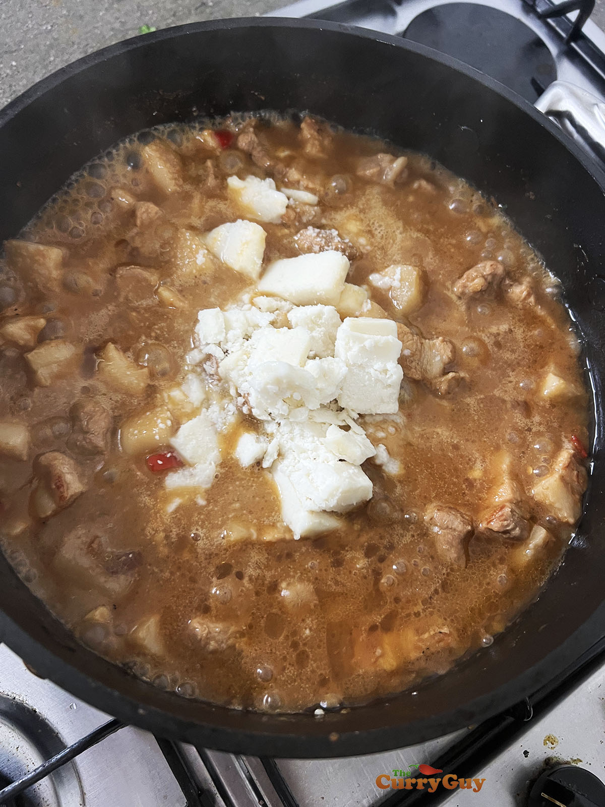 Stirring block coconut to the pan