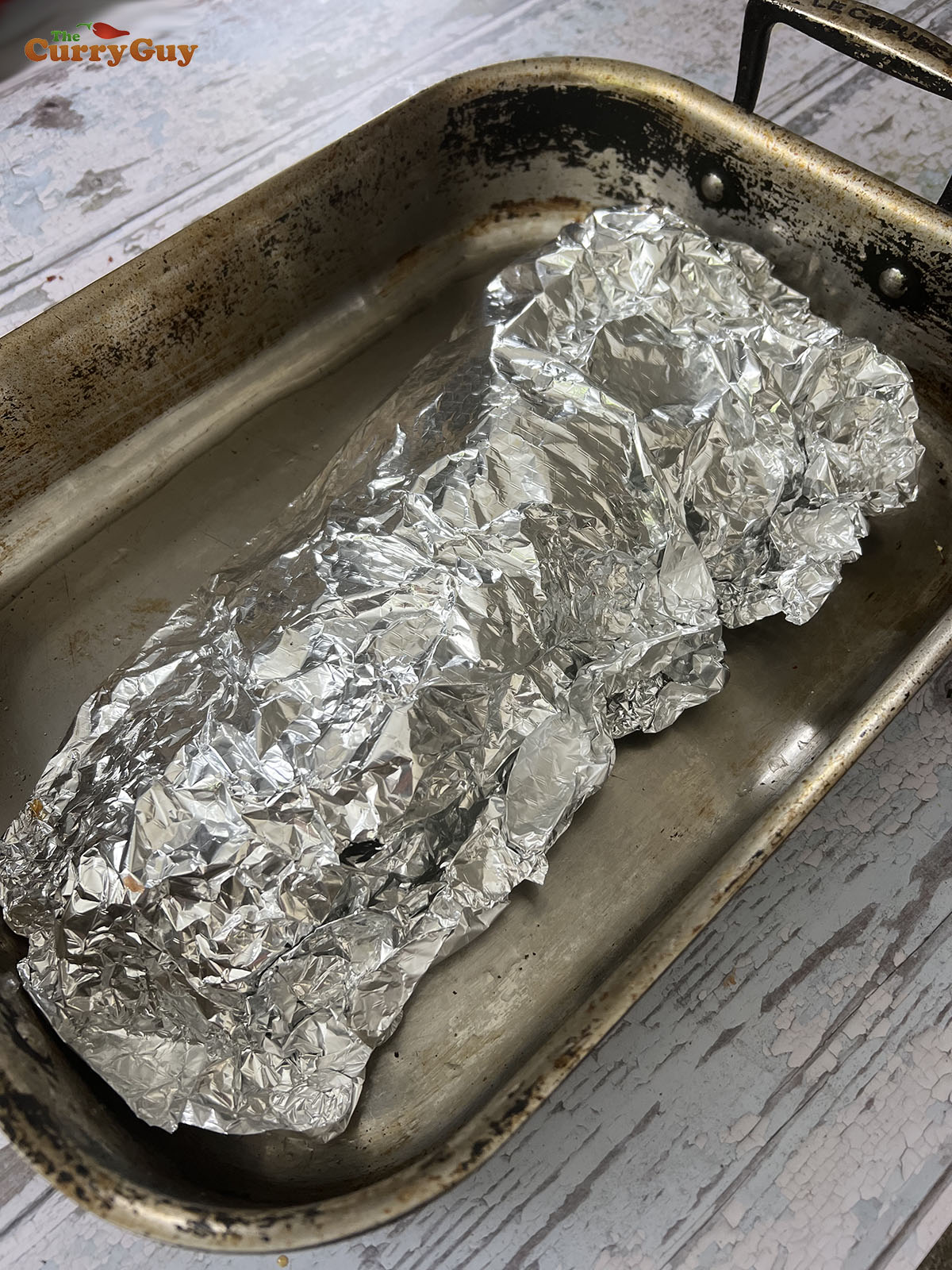 Tightly wrapped salmon ready for baking