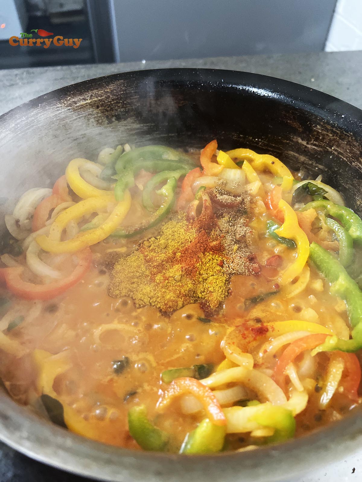 Adding the blended sauce.