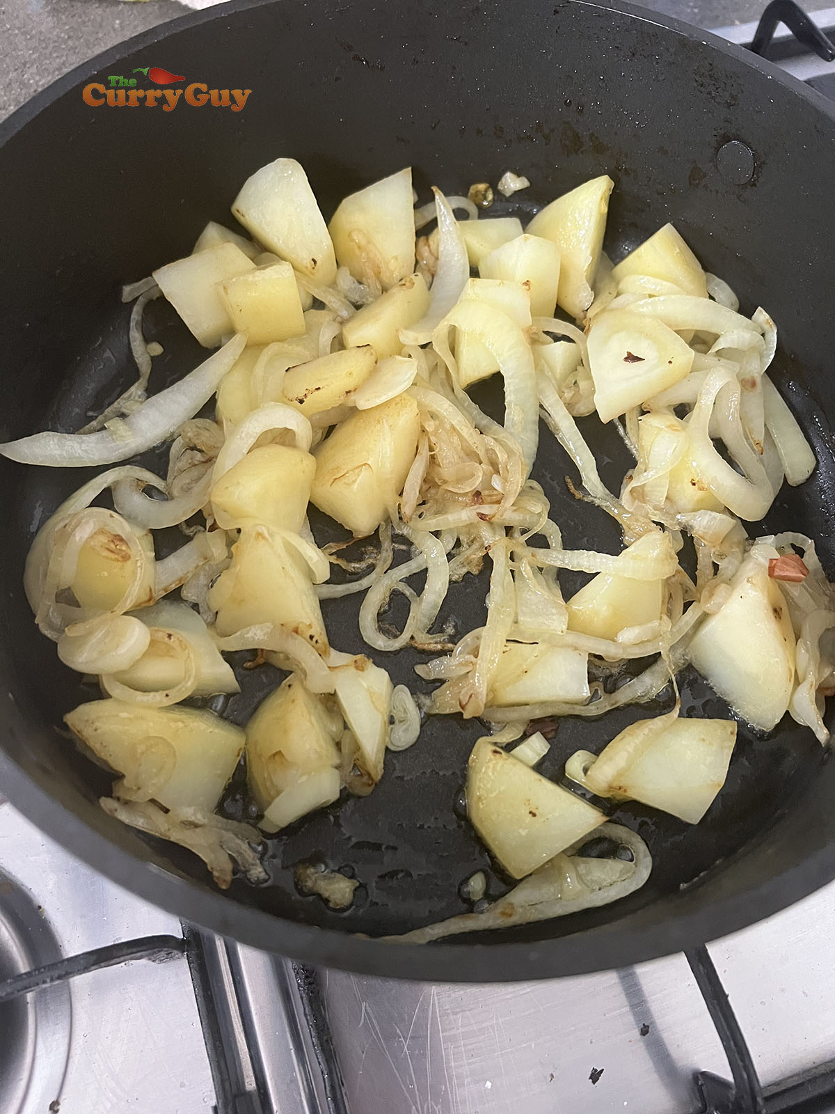 Adding potatoes to the pan