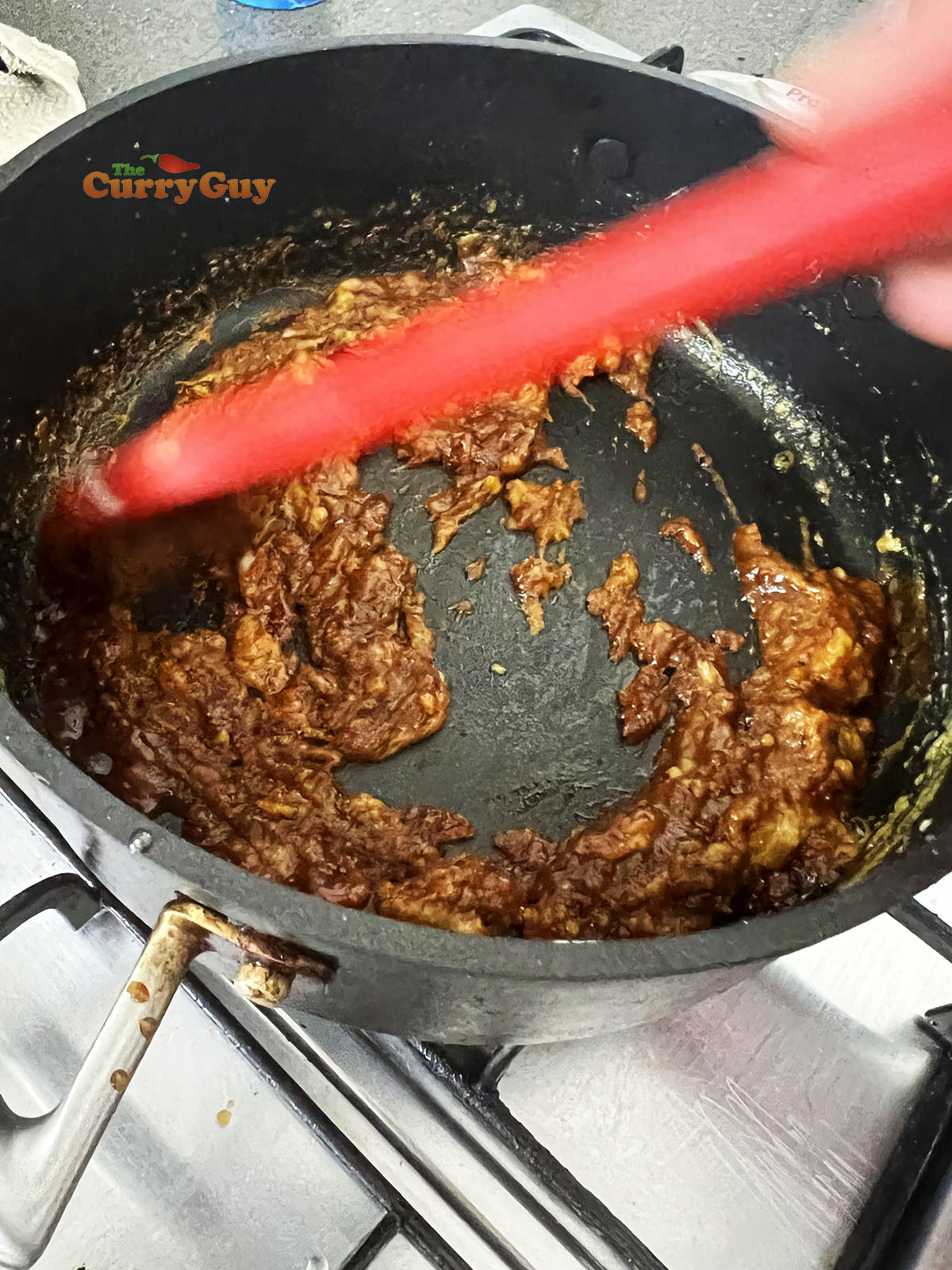 Stirring apple sauce into the roux