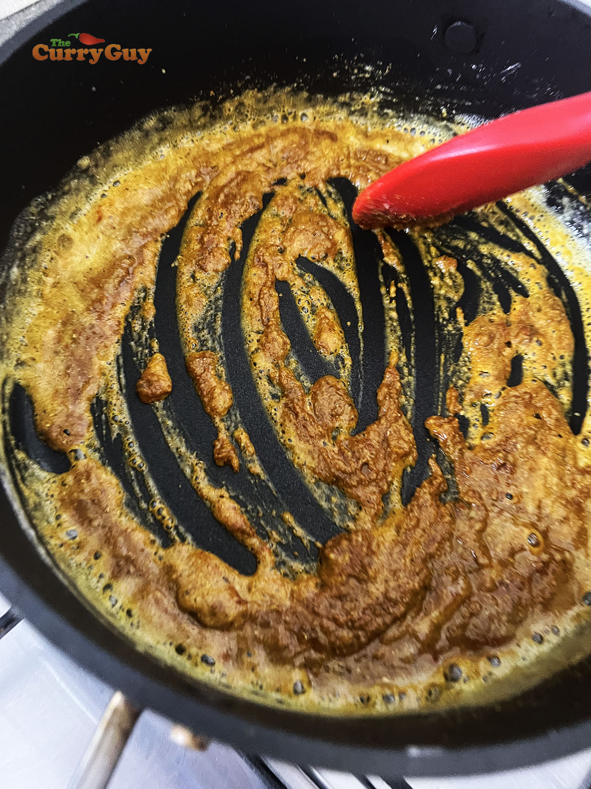 Stirring spices into the roux