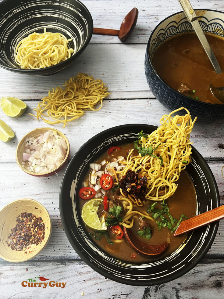 Finished beef khao soi at the dining table.