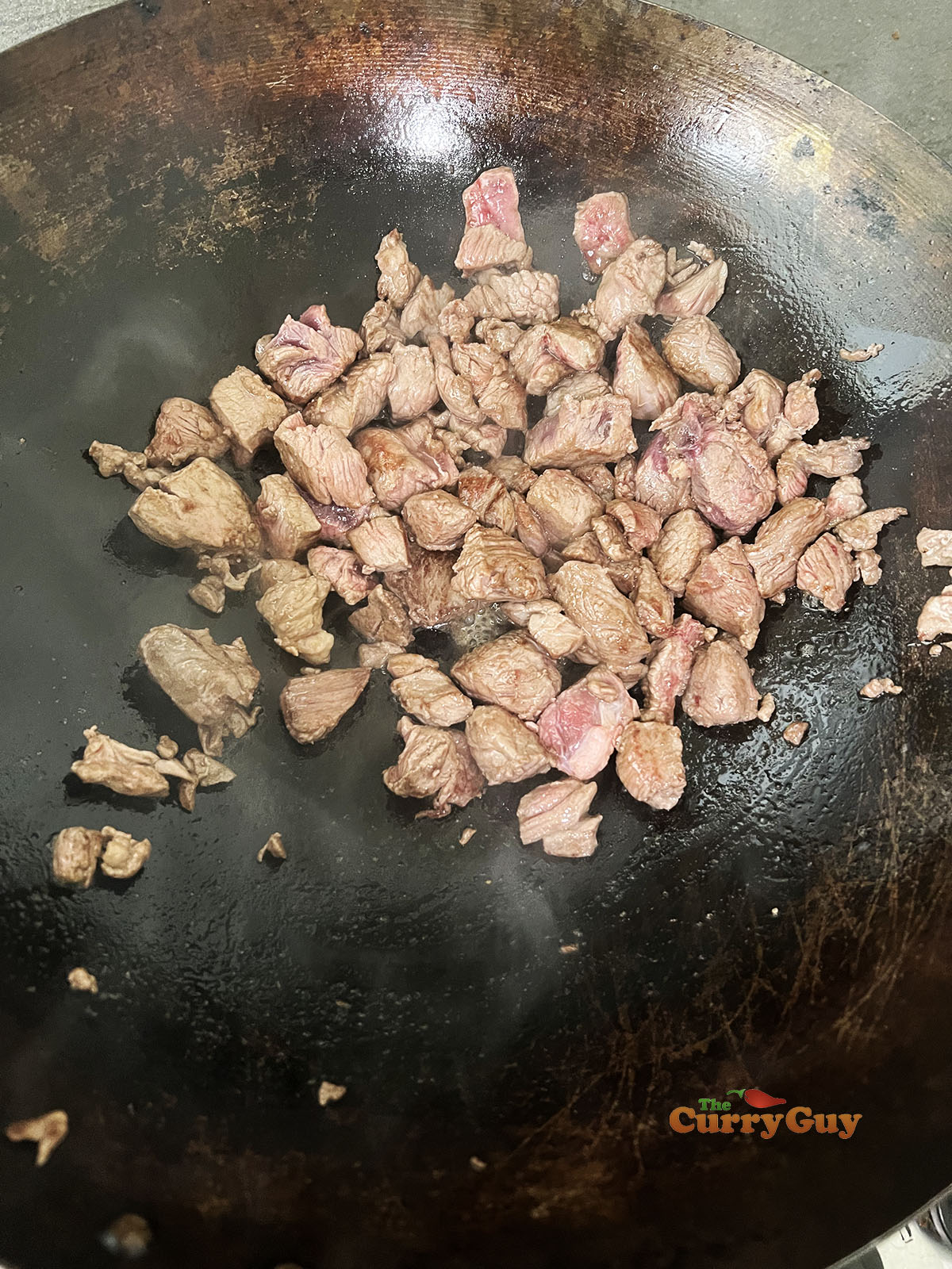 Browning meat in the wok