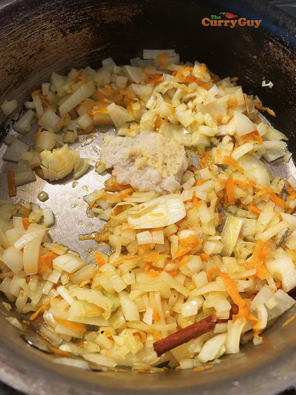 Adding garlic and ginger paste to the pan