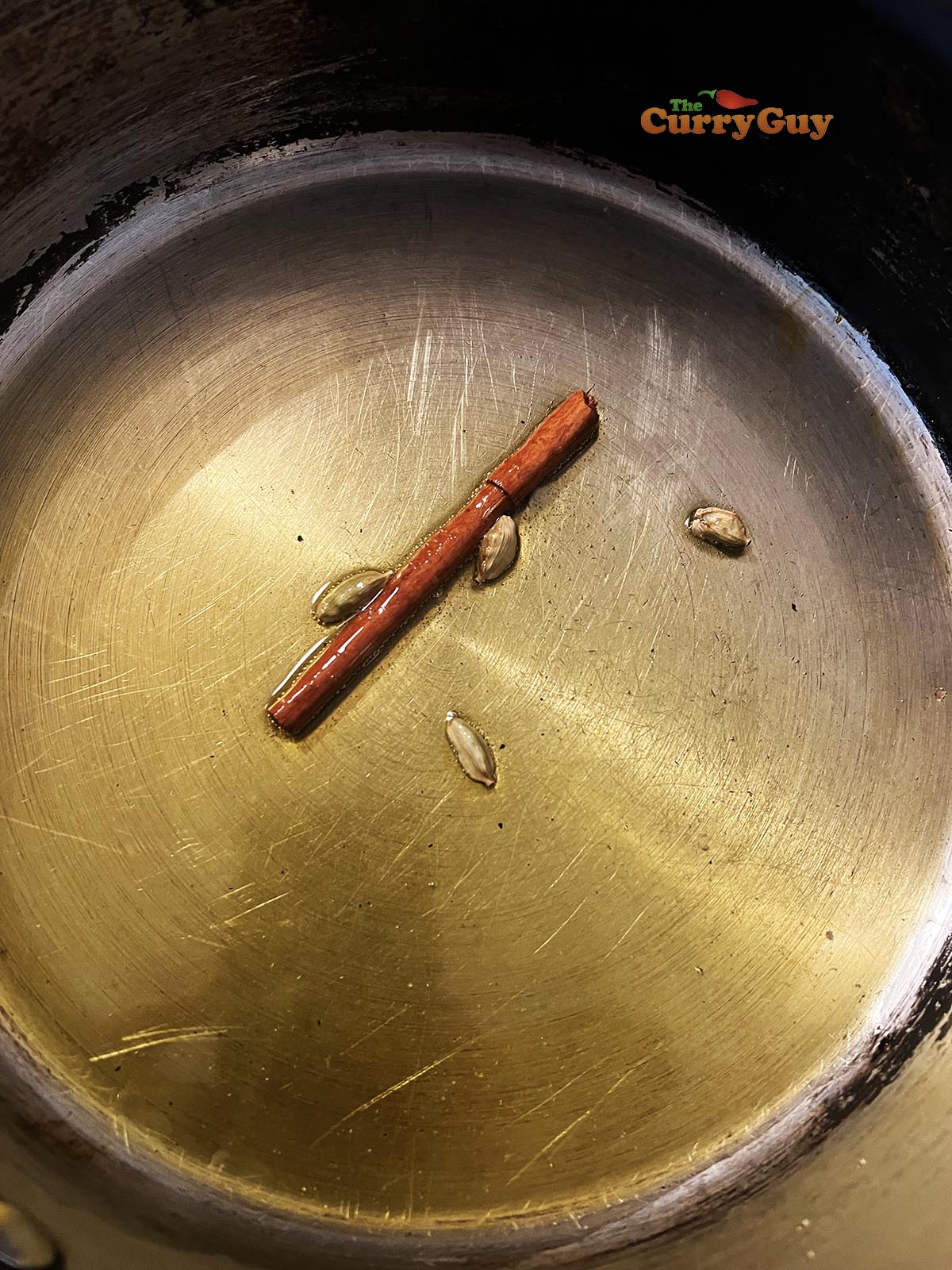 Infusing whole spices in ghee.