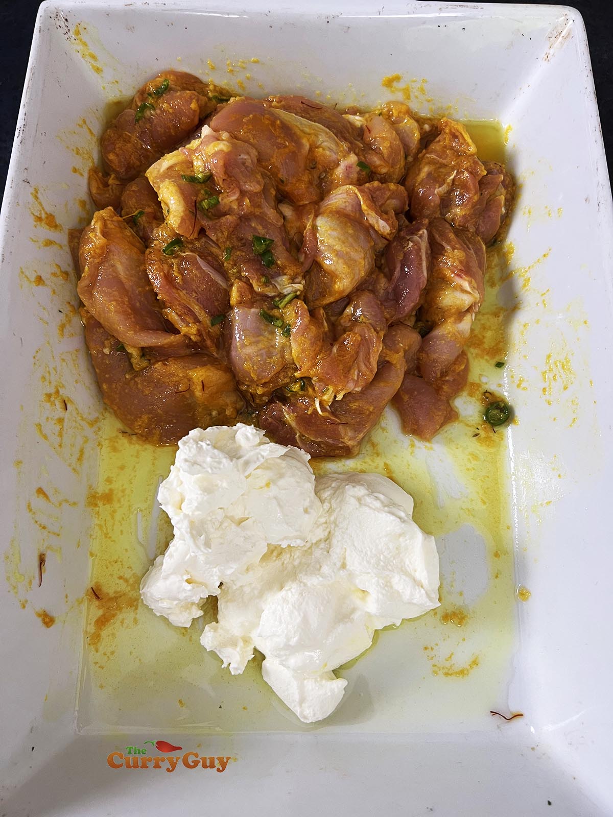 Adding cream cheese, cream and yoghurt to the mixing bowl