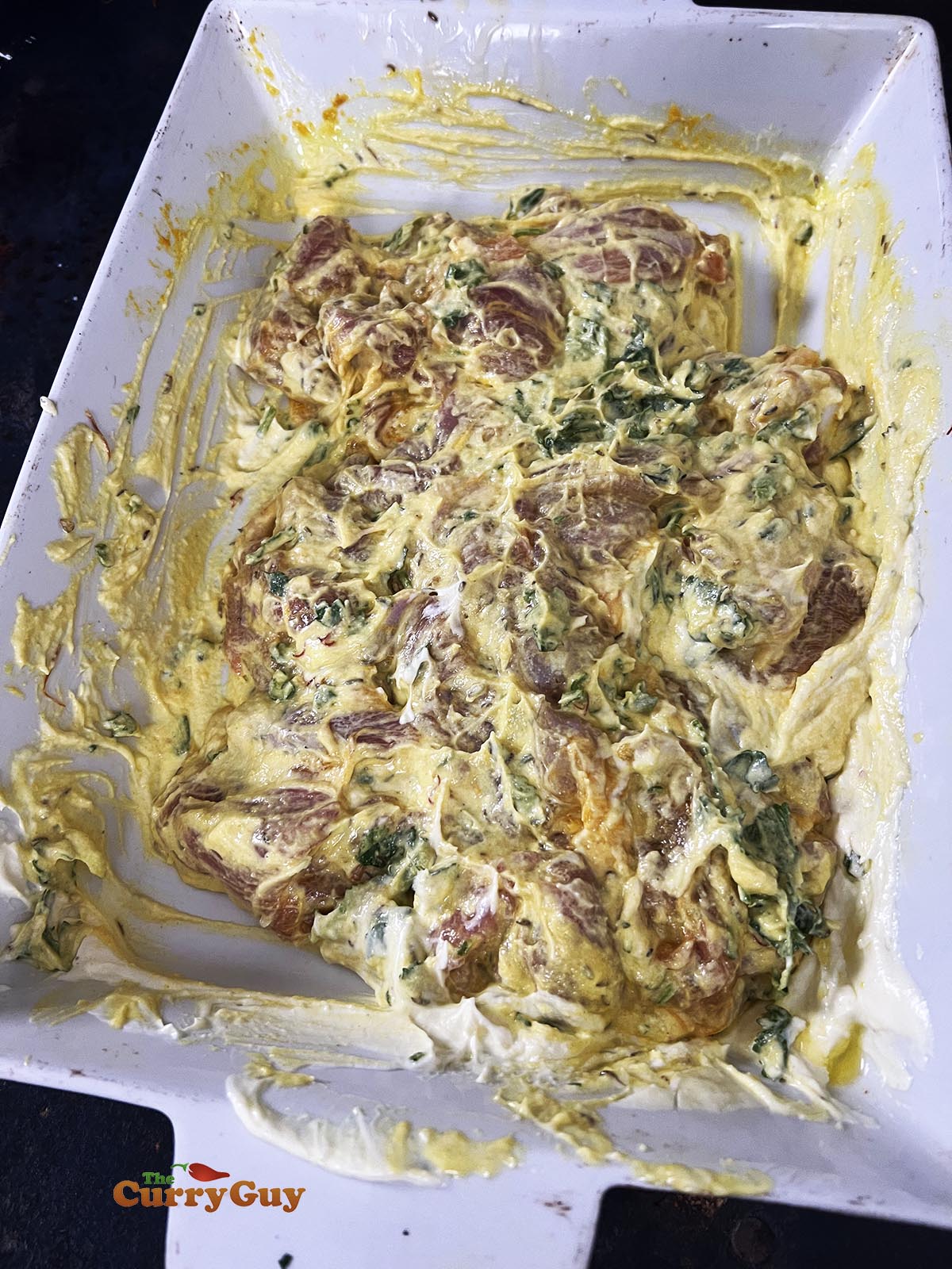 The meat marinating in finished marinade. 