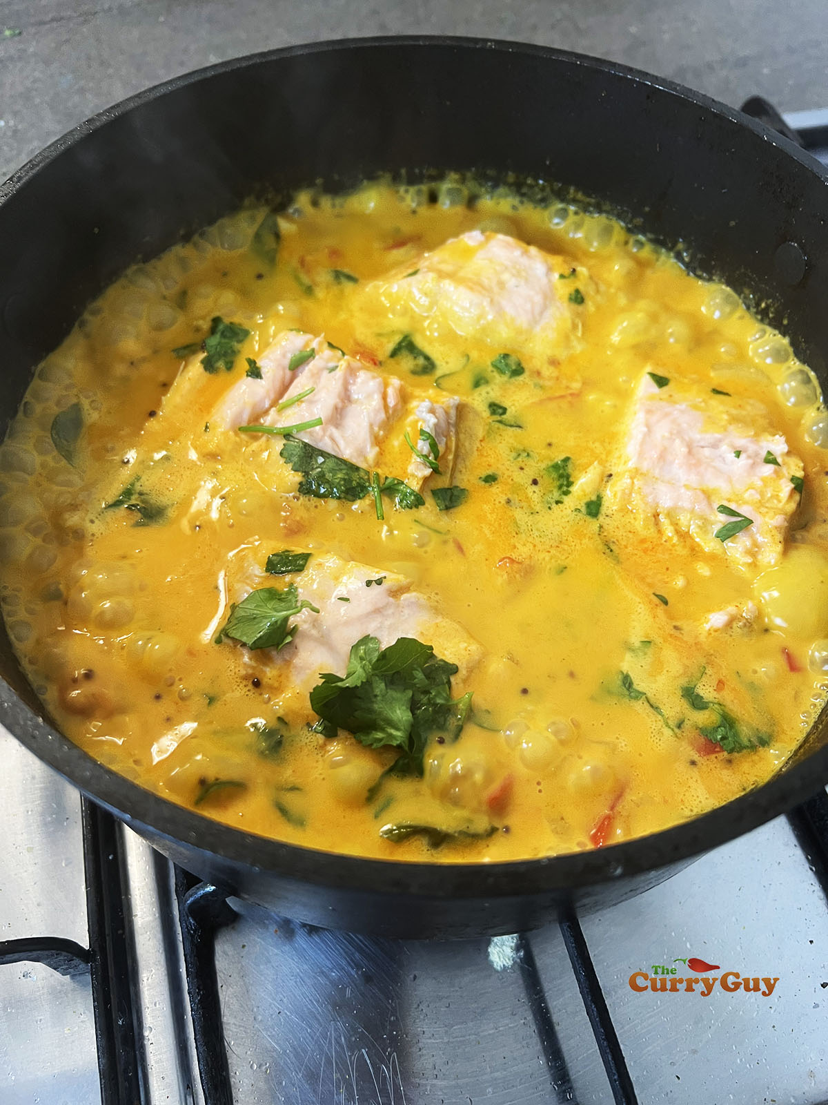 Cooked salmon in molee sauce