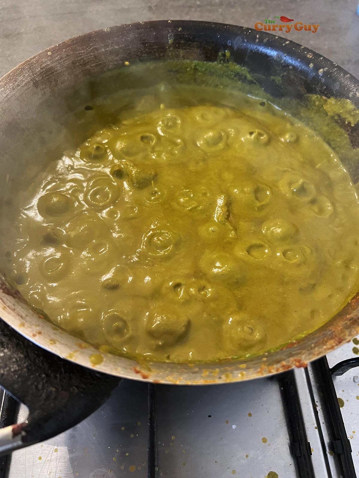 Adding spinach puree to the pan