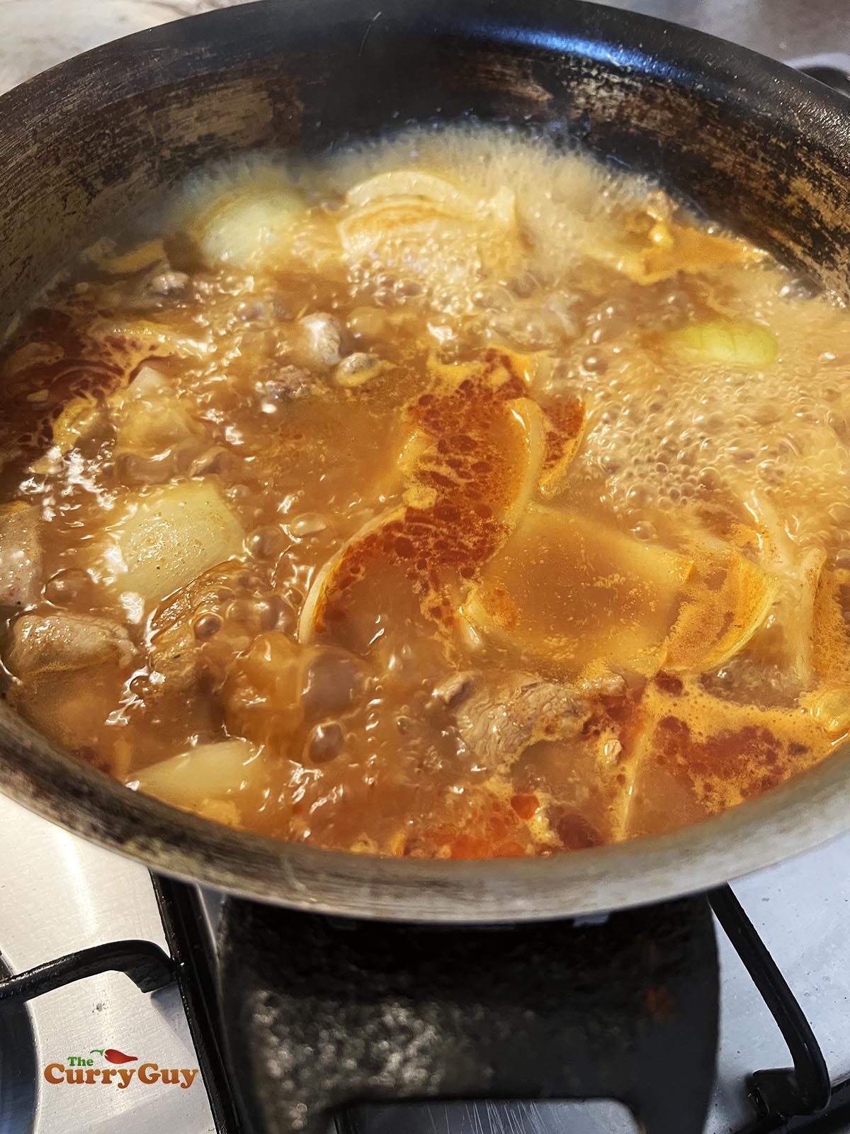 Simmering meat until tender