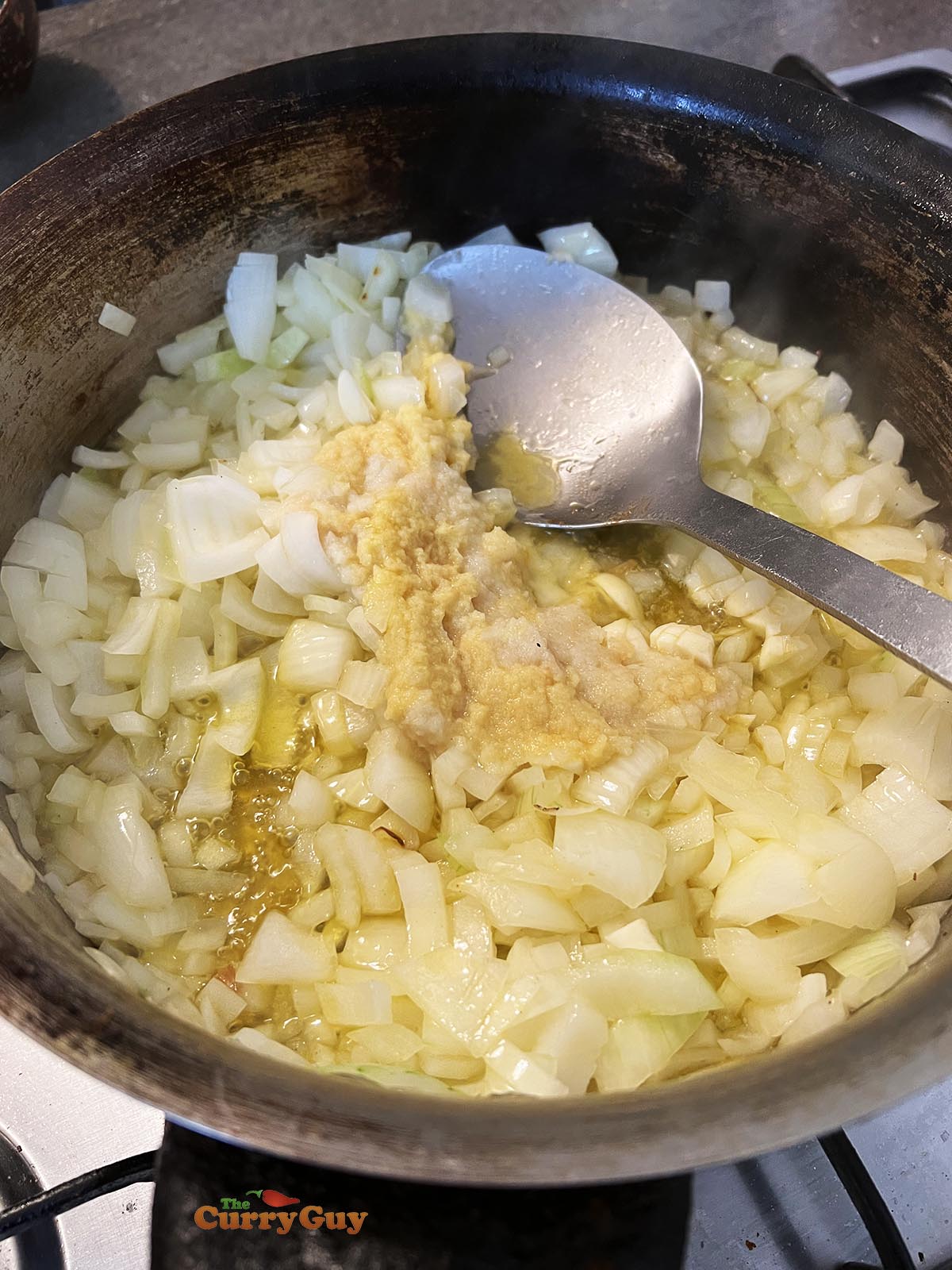 Frying the onions, garlic and ginger