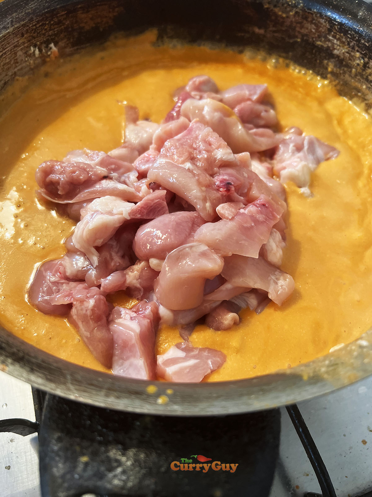 Adding chicken to the pan