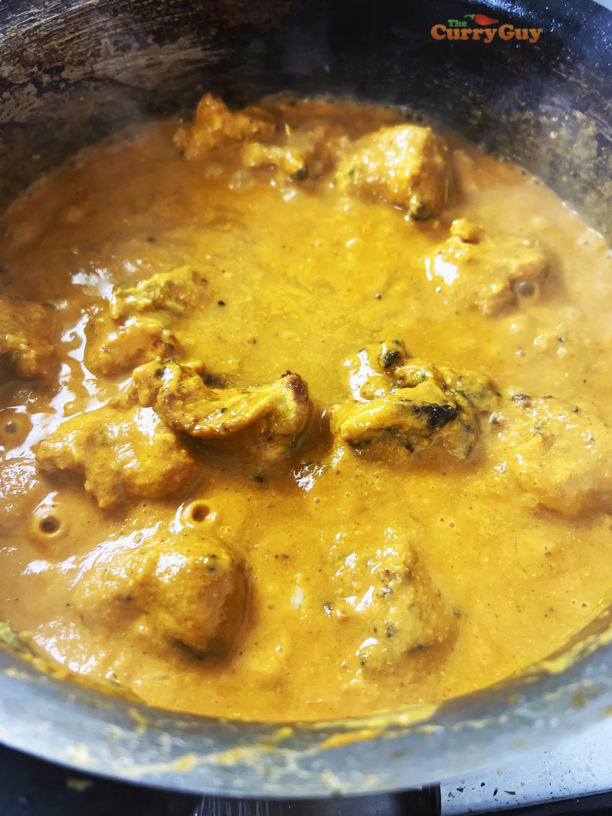 Adding chicken to the pan