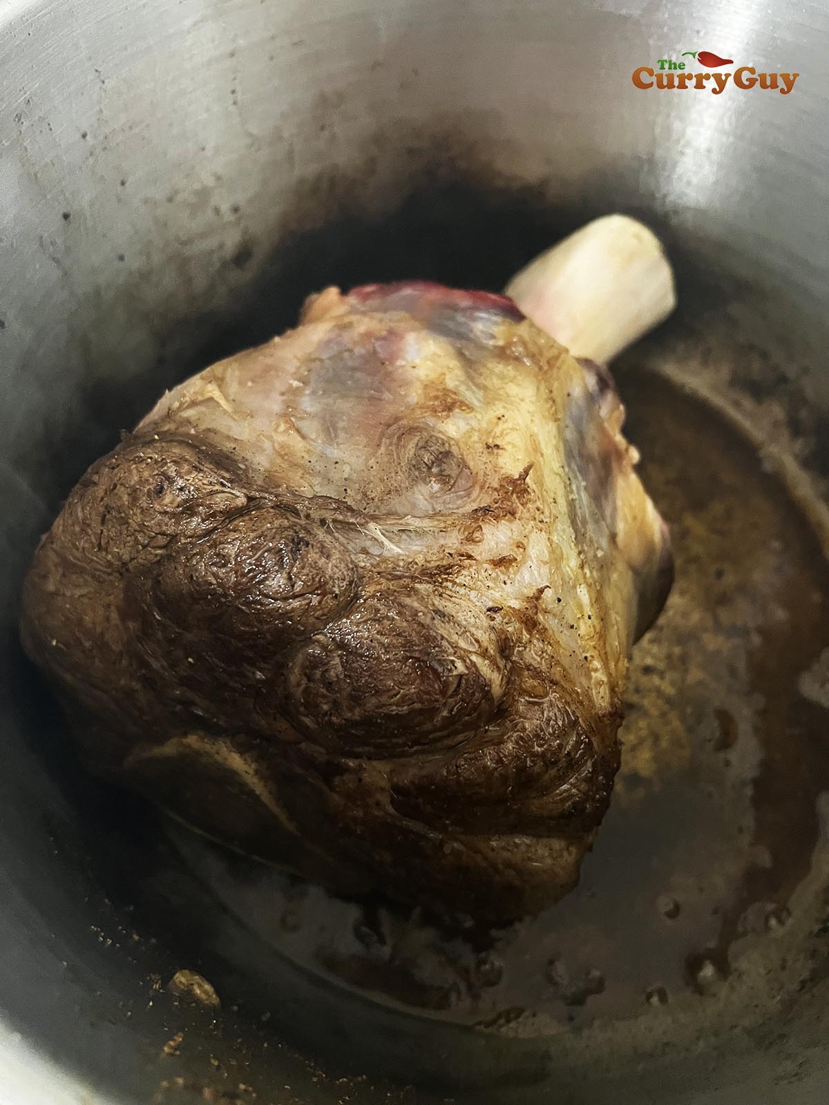 Returning the onion mixture to the pot