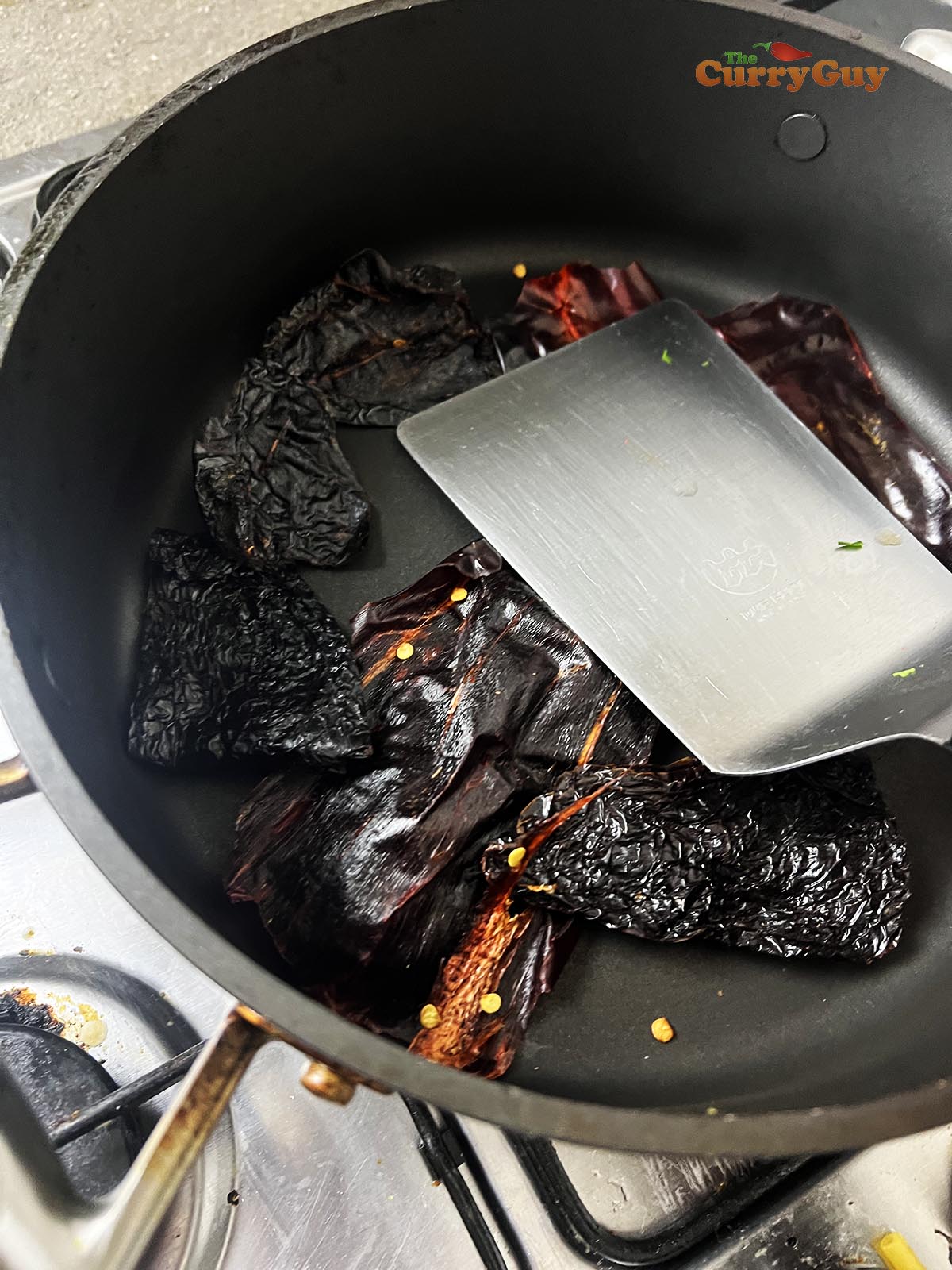 Toasting the chilies in the pan.