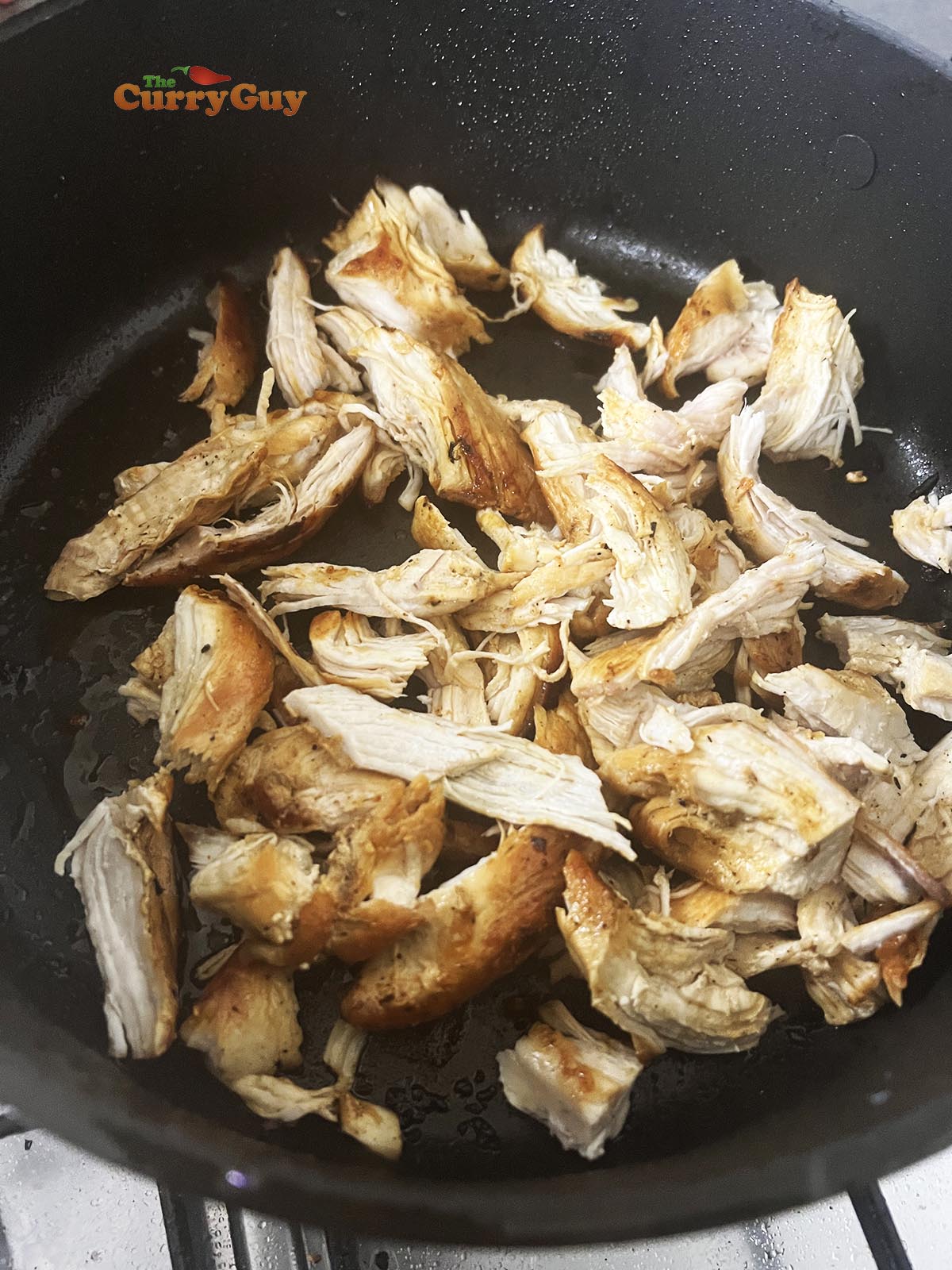 Shredded chicken in the pan