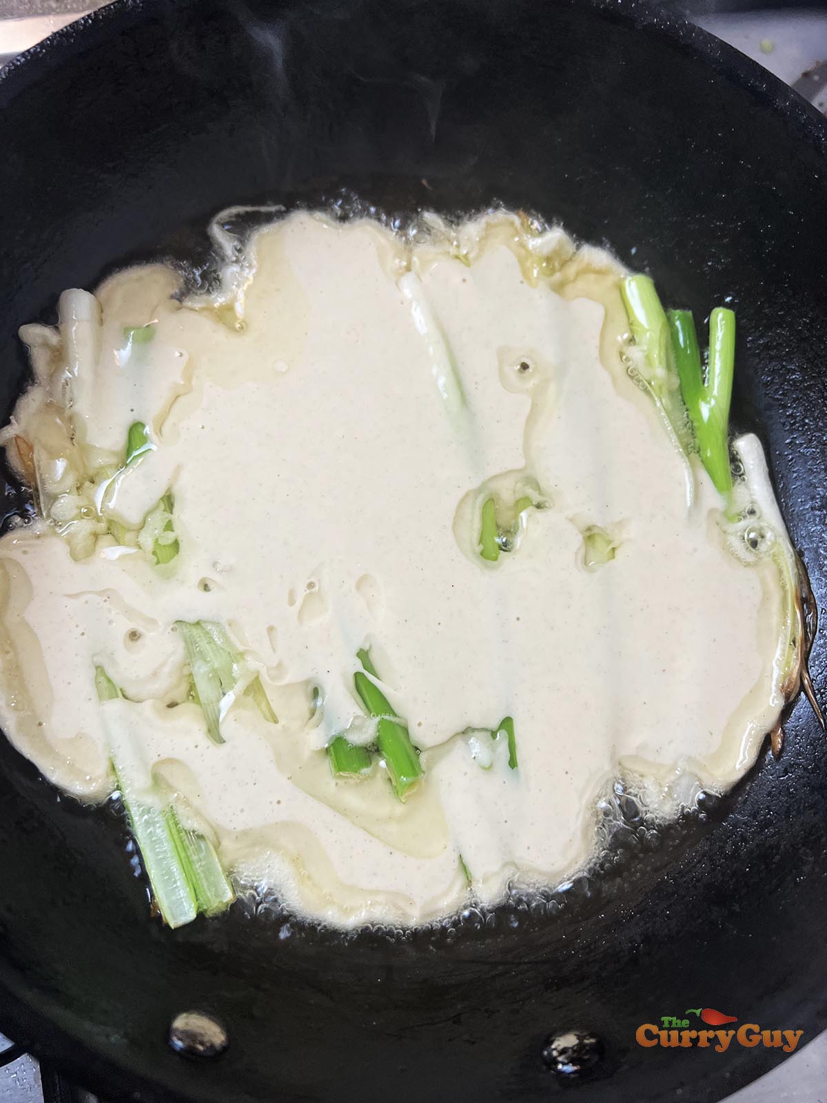 Adding the batter to the pan.