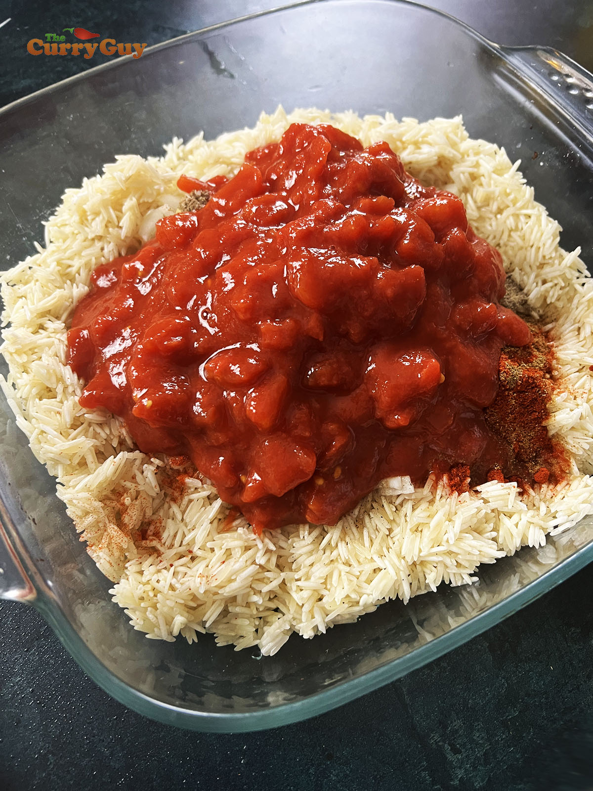 Adding tomatoes to the dish