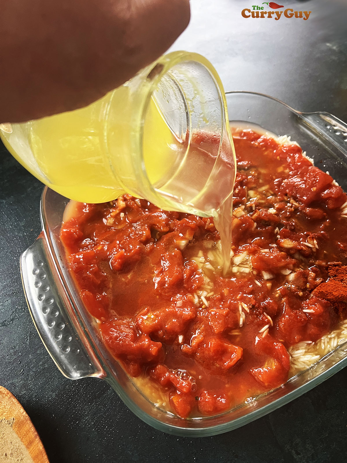 Pouring stock over the rice
