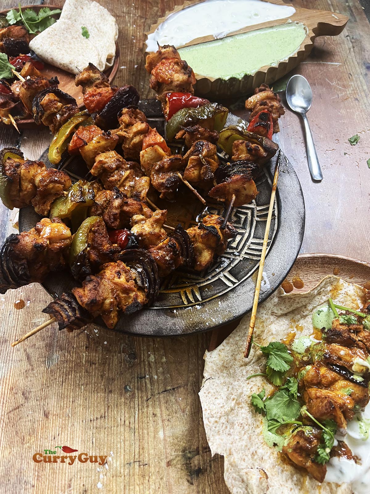 sheet pan chicken tikka with one chicken tikka wrap.